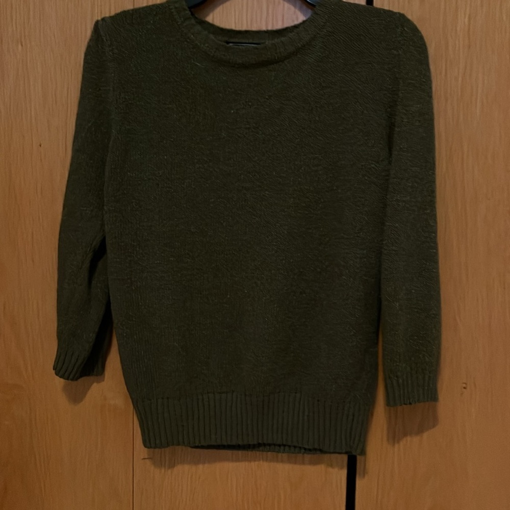 Green sweater with buttons on shoulder
